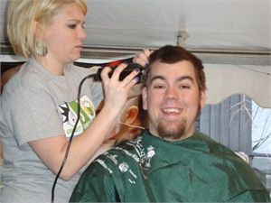 Logan Messer getting hair shaved