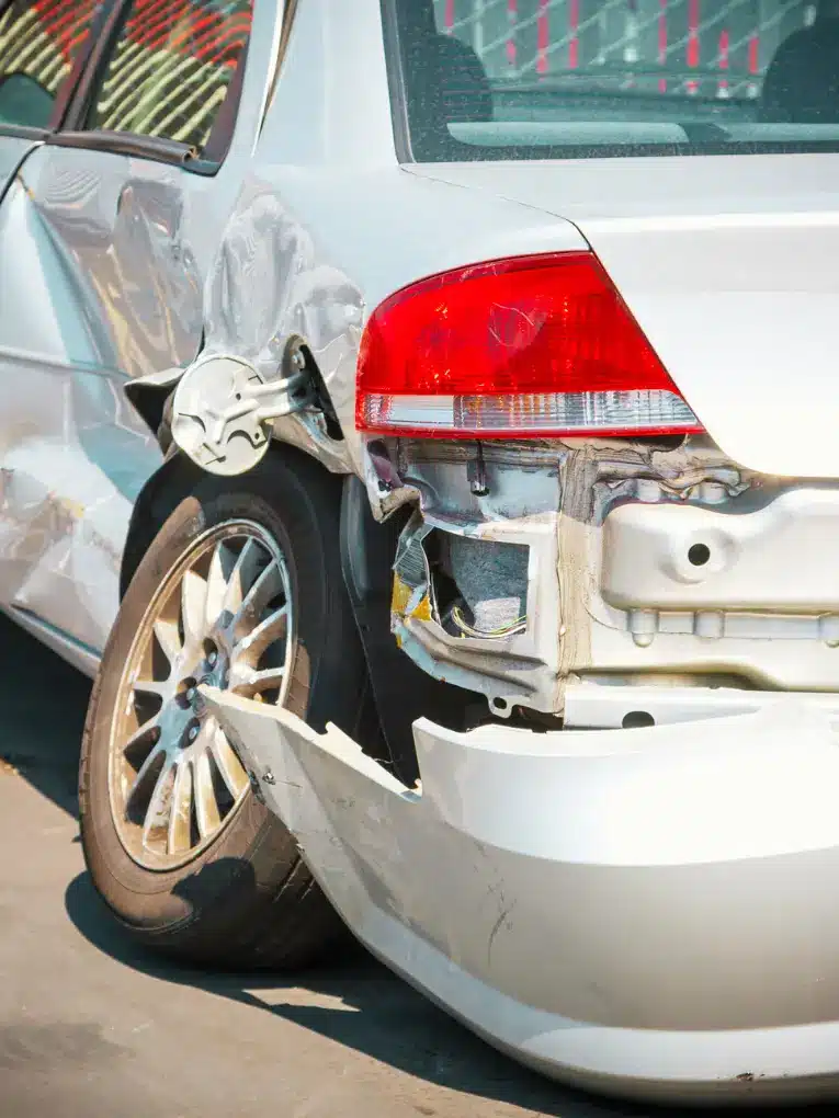 rear end collision damage silver car bumper